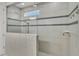Bright, modern bathroom featuring a glass-enclosed shower, tiled walls, and a convenient shower niche at 117 Harbor Trace Ln, Summerville, SC 29486