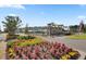 Community entrance featuring beautiful flower beds and well-maintained landscaping at 117 Harbor Trace Ln, Summerville, SC 29486