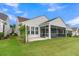 Charming home exterior featuring a screened porch and well-maintained lawn at 117 Harbor Trace Ln, Summerville, SC 29486