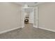 Versatile room showcasing French doors, neutral walls, and wood-look tile flooring at 117 Harbor Trace Ln, Summerville, SC 29486