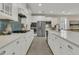 Spacious kitchen featuring white cabinets, quartz countertops, and a blue subway tile backsplash at 117 Harbor Trace Ln, Summerville, SC 29486