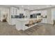 Gourmet kitchen with white cabinets, quartz countertops, stainless steel appliances, and an island with seating at 117 Harbor Trace Ln, Summerville, SC 29486
