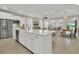 Open-concept kitchen featuring a large island, stainless steel appliances, and a seamless transition to the living area at 117 Harbor Trace Ln, Summerville, SC 29486