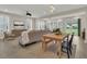 Bright living space featuring an open layout, dining area, and view to the backyard through a glass door at 117 Harbor Trace Ln, Summerville, SC 29486