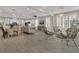 Spacious open-concept living area with modern furnishings, bright windows, and a seamless kitchen view at 117 Harbor Trace Ln, Summerville, SC 29486