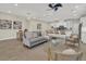 Open-concept living space with modern furnishings seamlessly connects the kitchen and dining areas at 117 Harbor Trace Ln, Summerville, SC 29486