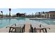 Beautiful community pool with plenty of lounge chairs and a clear blue sky at 117 Harbor Trace Ln, Summerville, SC 29486