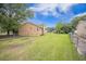 Expansive backyard features a well-maintained lawn and secure chain-link fence at 117 Myer Ln, Goose Creek, SC 29445