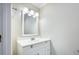 Bright bathroom features a white vanity with storage and modern lighting fixtures at 117 Myer Ln, Goose Creek, SC 29445