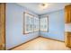 Blue dining room features hardwood floors, wood-framed windows, and white plantation shutters at 117 Myer Ln, Goose Creek, SC 29445