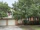 Charming two-story home with a well-manicured front lawn and mature trees at 117 Myer Ln, Goose Creek, SC 29445