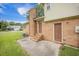 Exterior of home showcasing brick facade, doors, and concrete patio at 117 Myer Ln, Goose Creek, SC 29445
