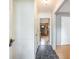 Hallway features stone tile and a view of the living room with hardwood floors at 117 Myer Ln, Goose Creek, SC 29445