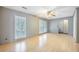 Light-filled living room with hardwood floors, plantation shutters, and neutral walls at 117 Myer Ln, Goose Creek, SC 29445