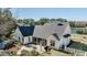 Exterior backyard view with a screened-in porch and outdoor dining area at 1174 Hitchfield Ln, Awendaw, SC 29429