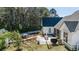 Backyard exterior showcasing a patio area with outdoor furniture and landscaping at 1174 Hitchfield Ln, Awendaw, SC 29429