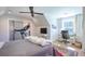 Bright bedroom featuring a ceiling fan, workspace, and exercise equipment at 1174 Hitchfield Ln, Awendaw, SC 29429