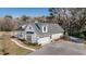 Exterior side view of home showing attached garage and front porch at 1174 Hitchfield Ln, Awendaw, SC 29429