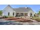 Beautiful home exterior with manicured landscaping and screened-in porch at 1174 Hitchfield Ln, Awendaw, SC 29429