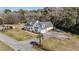 Charming home featuring a covered porch, well-manicured lawn, and gravel driveway at 1174 Hitchfield Ln, Awendaw, SC 29429