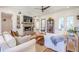 Inviting living area with shiplap walls, brick fireplace, built-ins, and stylish decor create a cozy feel at 1174 Hitchfield Ln, Awendaw, SC 29429