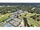 An aerial view showcases a community with a golf course, pool and tennis courts at 1182 Welcome Dr Dr, Mount Pleasant, SC 29464