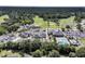An aerial view showcases a community with a golf course, pool and tennis courts at 1182 Welcome Dr Dr, Mount Pleasant, SC 29464