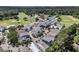 An aerial view showcases a community with a golf course, pool and tennis courts at 1182 Welcome Dr Dr, Mount Pleasant, SC 29464