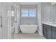 Bright bathroom featuring a modern white soaking tub and blue walls at 1182 Welcome Dr Dr, Mount Pleasant, SC 29464