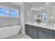 Bright bathroom features a soaking tub, double vanity, and modern finishes at 1182 Welcome Dr Dr, Mount Pleasant, SC 29464