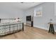 Cozy bedroom features hardwood floors, a metal frame bed, a modern cube shelf, and a bright window at 1182 Welcome Dr Dr, Mount Pleasant, SC 29464