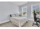 Neutral bedroom with great natural light showcases two windows and plush carpeting at 1182 Welcome Dr Dr, Mount Pleasant, SC 29464