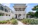 Charming two-story home featuring a welcoming porch, lush landscaping, and a 'Welcome Dr' street sign at 1182 Welcome Dr Dr, Mount Pleasant, SC 29464