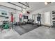 Spacious garage with a home gym, weightlifting equipment, bikes, and ample storage at 1182 Welcome Dr Dr, Mount Pleasant, SC 29464