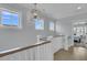Upstairs hallway features white trim, oak handrail, and views to a bedroom at 1182 Welcome Dr Dr, Mount Pleasant, SC 29464