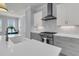 Large kitchen featuring a central island, custom cabinets, stainless appliances, and marble counters at 1182 Welcome Dr Dr, Mount Pleasant, SC 29464