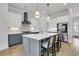 Bright modern kitchen features a large island, stainless appliances, and custom lighting at 1182 Welcome Dr Dr, Mount Pleasant, SC 29464