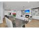 Open-concept living space combines the dining and living rooms with a modern kitchen at 1182 Welcome Dr Dr, Mount Pleasant, SC 29464