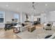 Spacious living room flows into kitchen with modern appliances, lots of natural light and hardwood floors at 1182 Welcome Dr Dr, Mount Pleasant, SC 29464