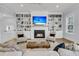 Inviting living room with a fireplace, built-in bookshelves and two comfortable chairs at 1182 Welcome Dr Dr, Mount Pleasant, SC 29464