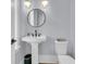 Clean powder room with pedestal sink, black hardware, and modern lighting at 1182 Welcome Dr Dr, Mount Pleasant, SC 29464
