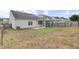 A spacious yard with a screened-in porch area providing a comfortable outdoor living space at 121 Ancestry Ln, Moncks Corner, SC 29461