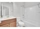 Well-lit bathroom with a vanity, toilet, and a clean, white shower-tub combination at 121 Ancestry Ln, Moncks Corner, SC 29461