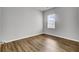 Bedroom featuring wood-look flooring and a window with blinds, providing natural light at 121 Ancestry Ln, Moncks Corner, SC 29461