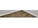 Close-up of wood-look flooring and white baseboards at 121 Ancestry Ln, Moncks Corner, SC 29461