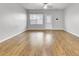 Spacious living room featuring hardwood floors and a back door to the backyard at 121 Ancestry Ln, Moncks Corner, SC 29461