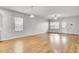 Bright, open living room with hardwood floors and ample natural light from large windows and a back door at 121 Ancestry Ln, Moncks Corner, SC 29461