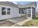 Back patio features screened-in porch, concrete floor, and lots of natural light at 121 Ancestry Ln, Moncks Corner, SC 29461