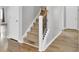 Staircase with carpeted steps and a decorative railing, connecting different levels of the home at 121 Ancestry Ln, Moncks Corner, SC 29461