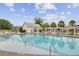 A beautiful community pool offers a relaxing retreat with lounge chairs and shaded pergola seating at 121 Ancestry Ln, Moncks Corner, SC 29461
